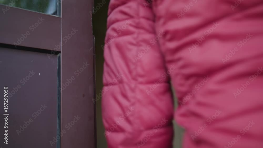 A man unlocks the door with a key and comes inside. Close-up shot. A man unlocks the door with a key and comes inside. Close-up shot.