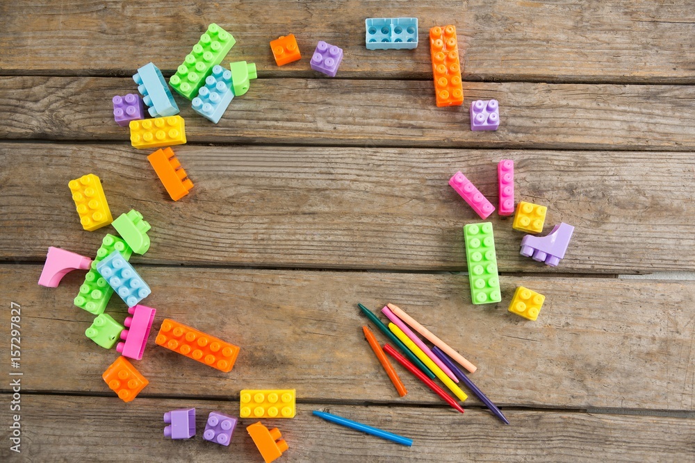 Overhead view of toy blocks with crayons Overhead view of toy blocks with crayons