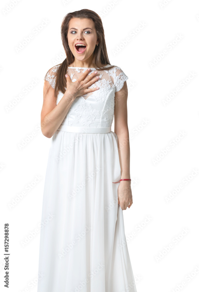 girl in a white dress surprised and holds the arm to the chest