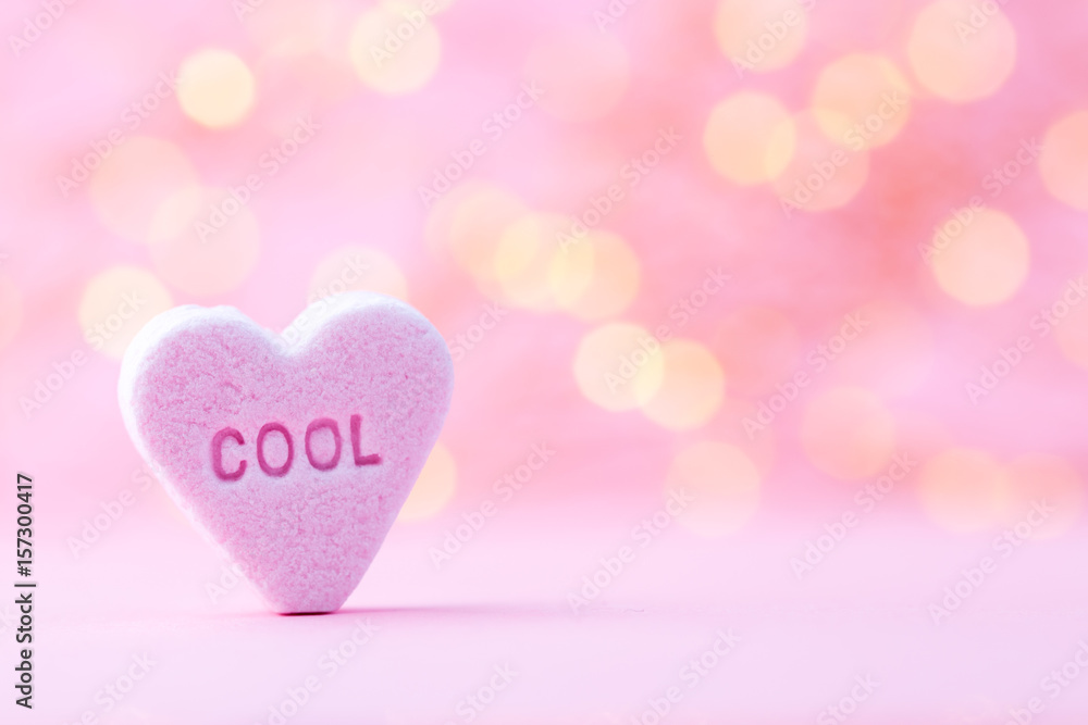 Pastel colored candy hearts in a bokeh background. Pastel colored candy hearts in a bokeh background.