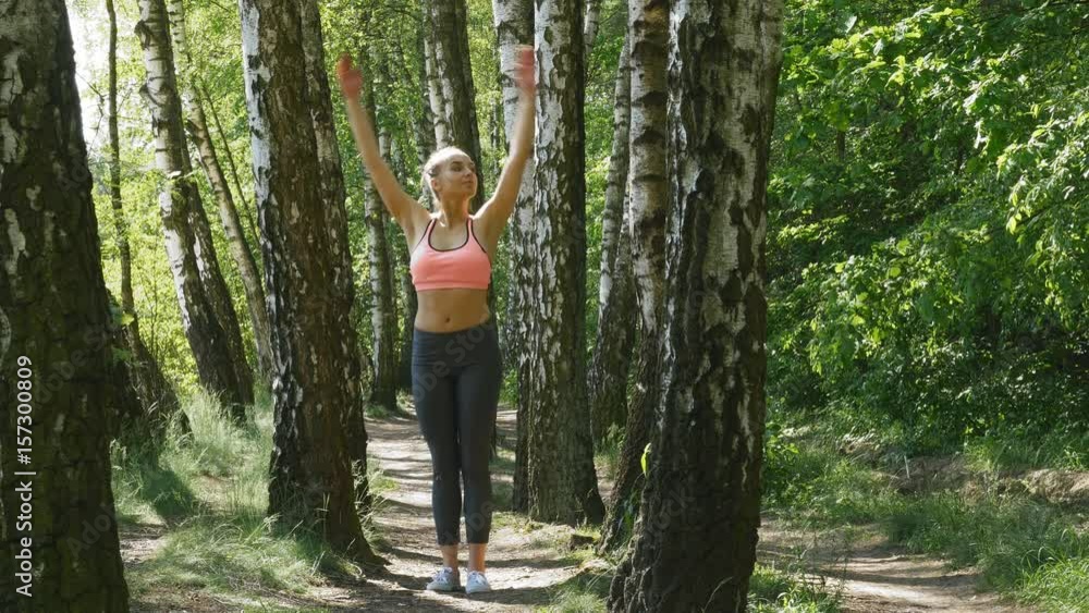 Woman is practicing in the forest Woman is practicing in the forest