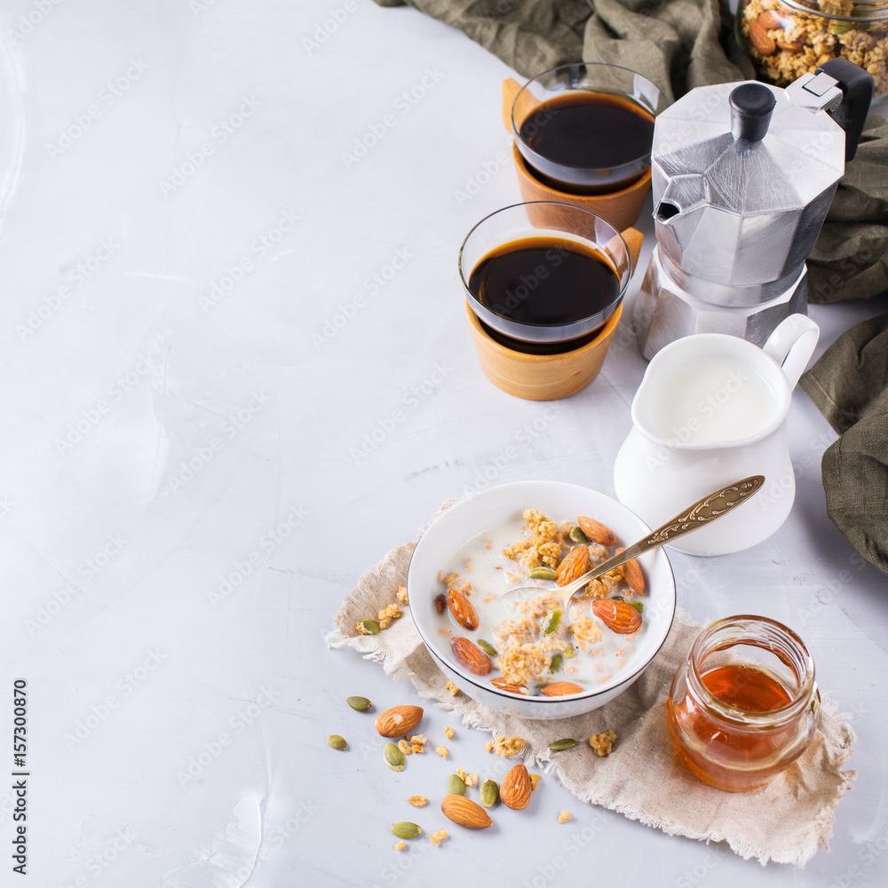 Breakfast with black coffee muesli granola honey nuts milk Breakfast with black coffee muesli granola honey nuts milk