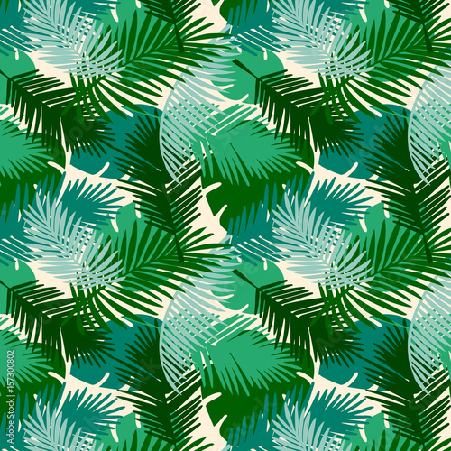 Seamless pattern tropical palm leaves on a white background. Vector tropic wallpaper design.