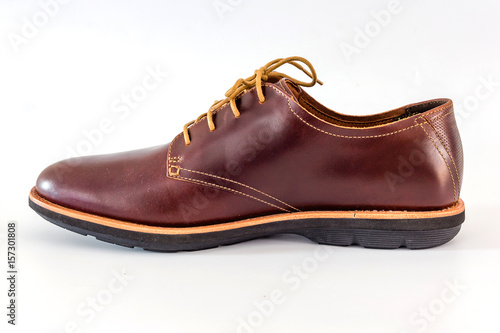 Men's classic brown leather shoes isolated on white background, Top view with copy space and text.