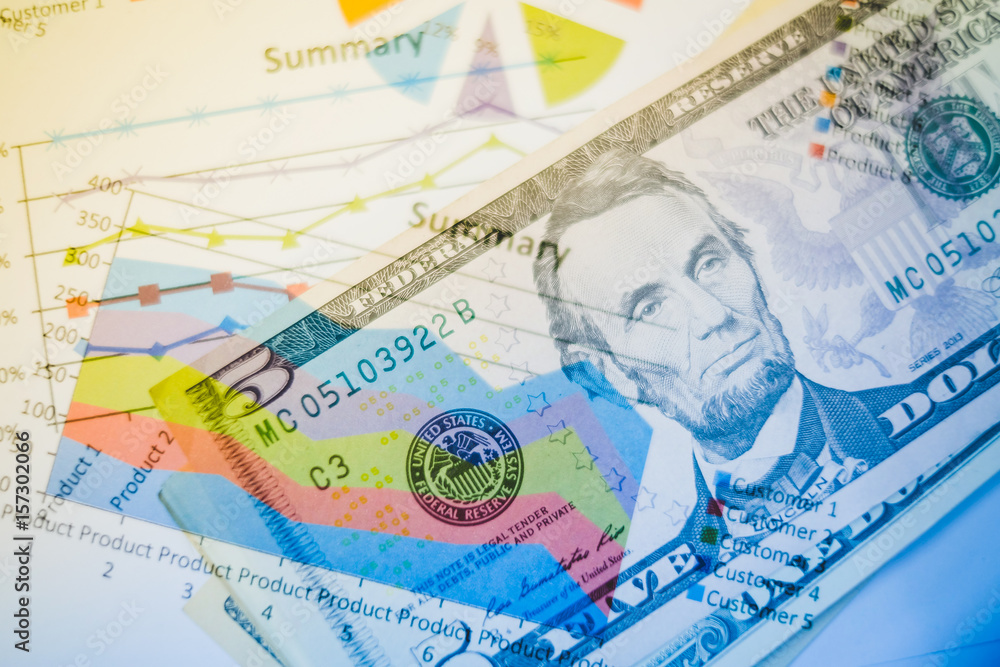 Double exposure of graph and dollars banknotes