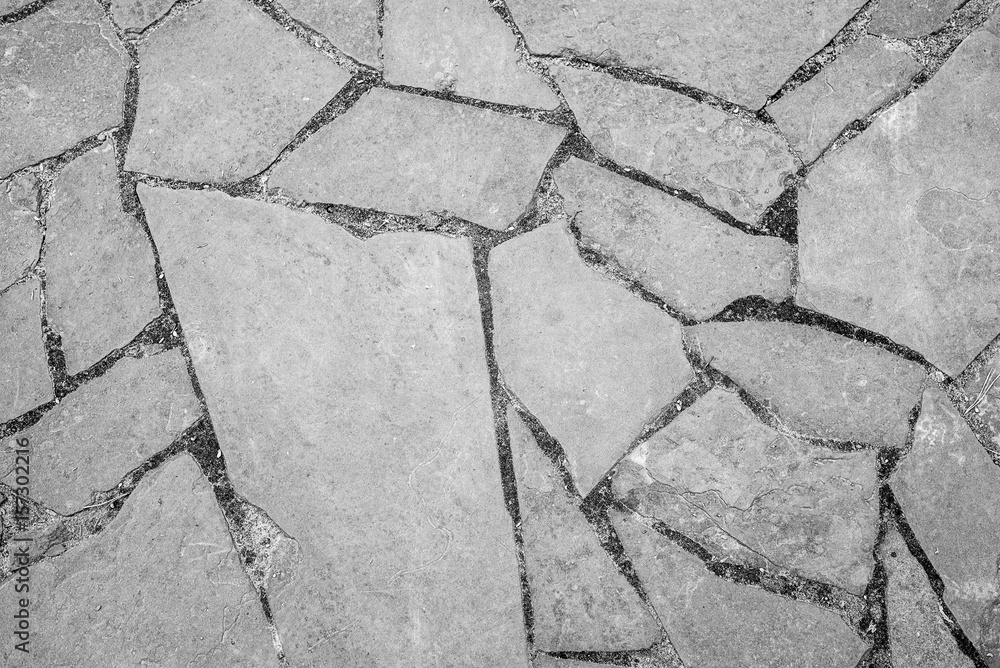 Obraz premium Natural background. Texture of a stone wall or a cracked rock, on the whole frame. Horizontal frame
