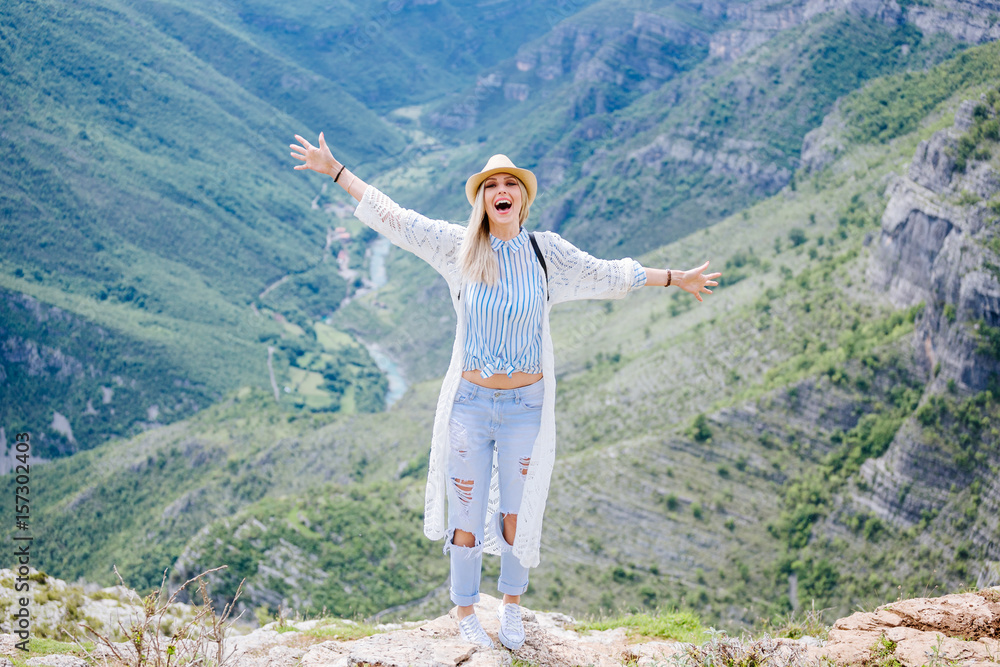 joyful woman travel mountains