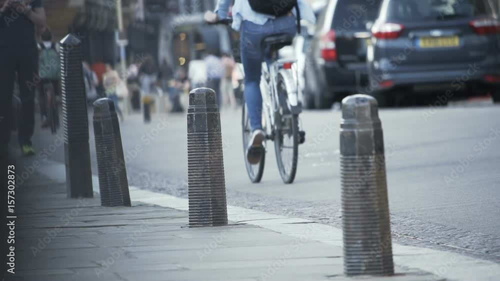 Slow motion of cyclist commuter in big city Slow motion of cyclist commuter in big city