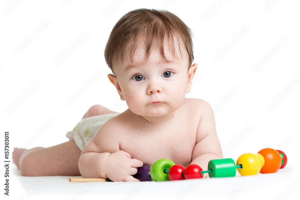 Portrait of cute baby boy with developmental wooden toys. Portrait of cute baby boy with developmental wooden toys.