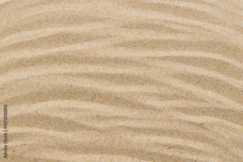 closeup of sand pattern of a beach in the summer for background closeup of sand pattern of a beach in the summer for background