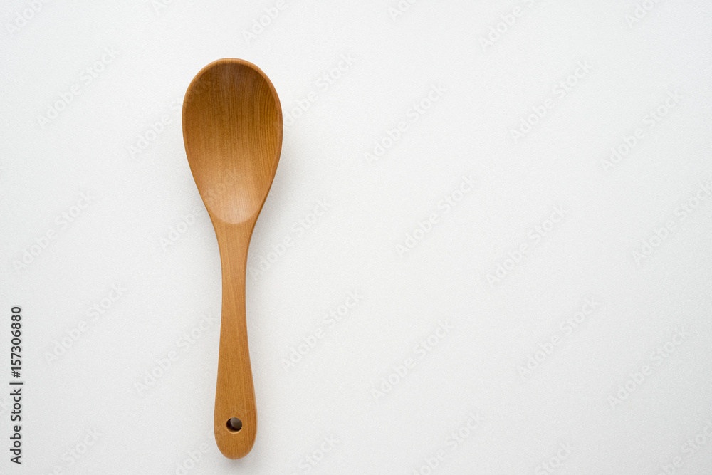 Close-up wooden spoon isolated on white background Close-up wooden spoon isolated on white background