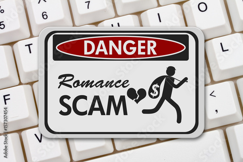 Romance Scam danger sign on a keyboard