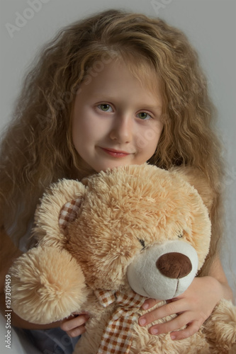 Girl 's portrait with teddybear