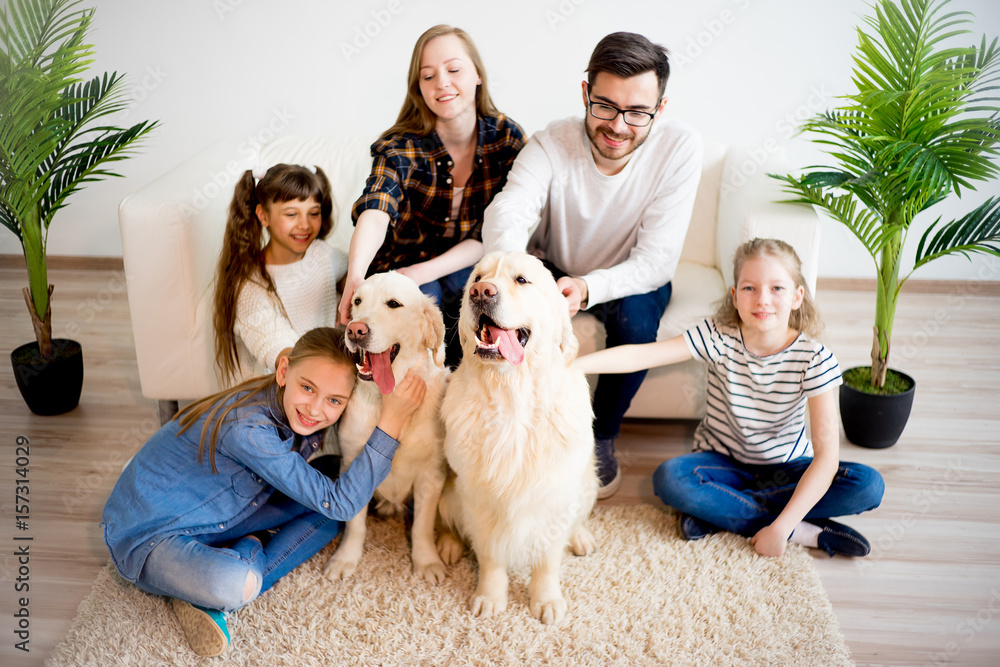 Family playing with a dog Family playing with a dog