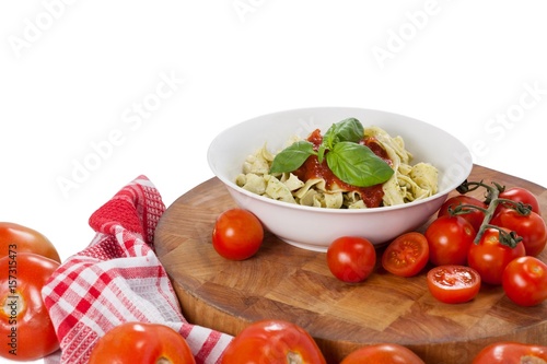 Fettuccine pasta with tomatoes, garlic and napkin cloth