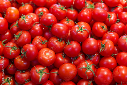 Group of fresh tomatoes as a background