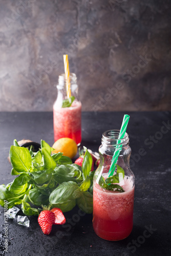 Strawberry smoothies in bottles photo