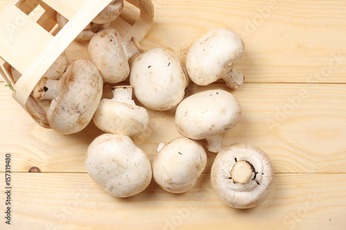 mushrooms on light wooden background. top view with copy space