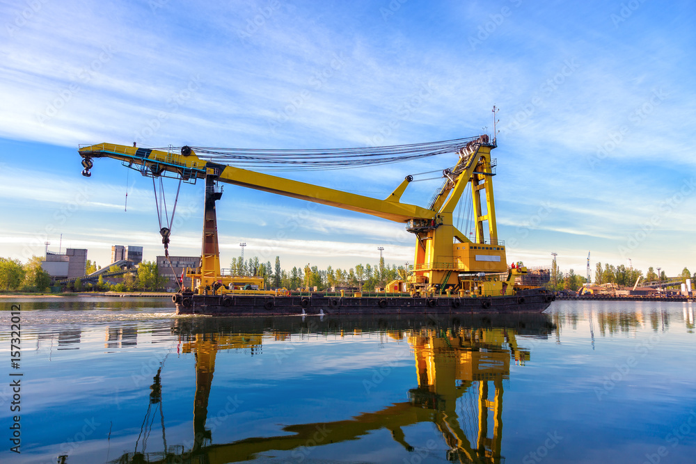 Huge floating crane at work in port of Gdansk, Poland.