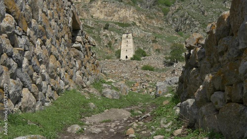 Old stone tower in ruined town photo