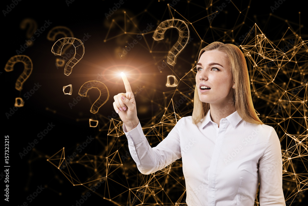 Fotografie Blond woman and virtual question marks