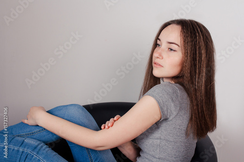 Portrait of young beautiful girl brunette in the Studio