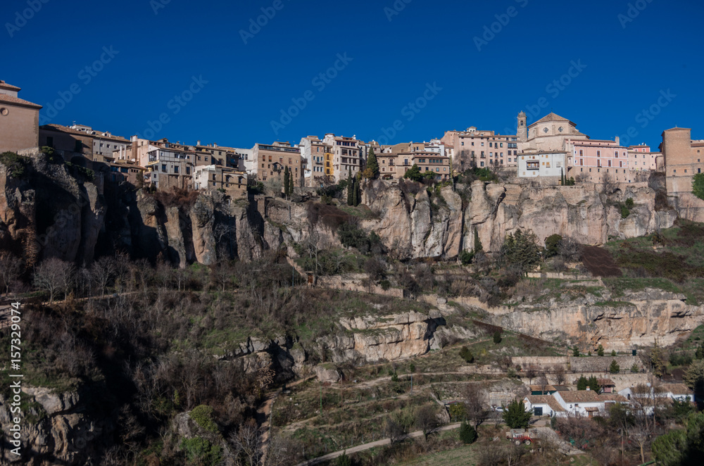View to hanging houses of Cuenca old town.  Example of a medieval city, built on the steep sides of a mountain. Many houses are built right up to the cliff edge. Cuenca, Spain