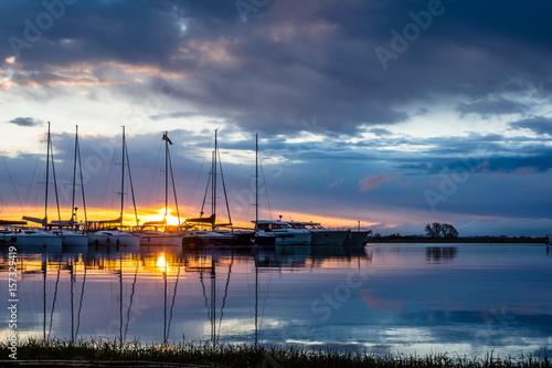 Fototapeta Naklejka Na Ścianę i Meble -  Sunrise on marina Wilkasy under lake Niegocin near Gizycko, Masuria, Poland