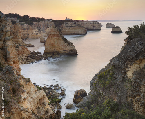 view to lagoon with rocks in sunset time in Portugal