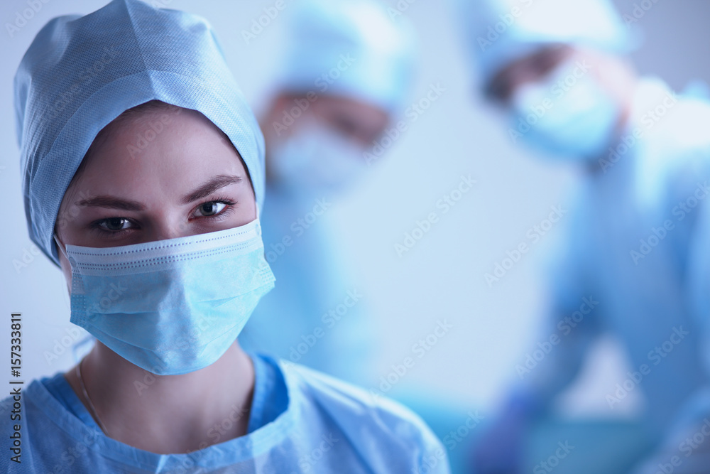 Team surgeon at work in operating room. Team surgeon at work in operating room.