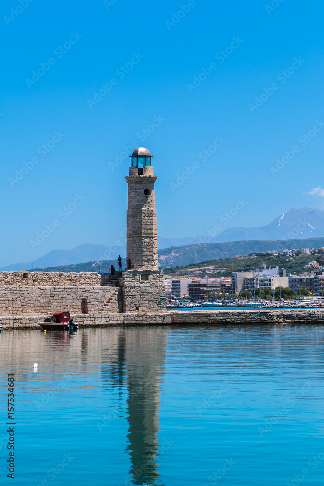 The old Venetian harbor with Lighthouse in Rethymno. Crete, Greece.