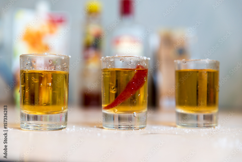 glasses with vodka and pepper glasses with vodka and pepper