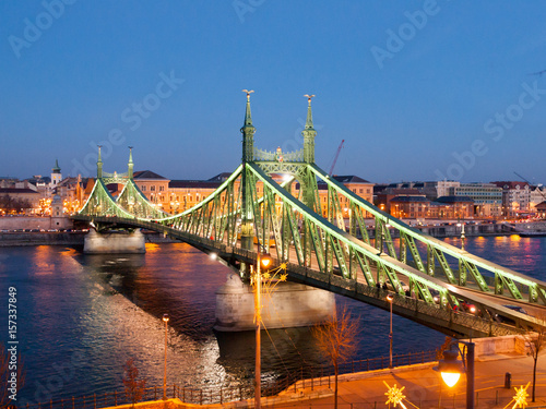 Illuminated Liberty Bridge and River Danube at night. Budapest, Hungary.