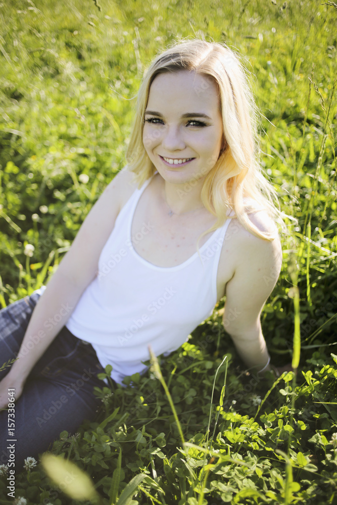 Female in White Tank Top and Jeans in a Pasture Female in White Tank Top and Jeans in a Pasture