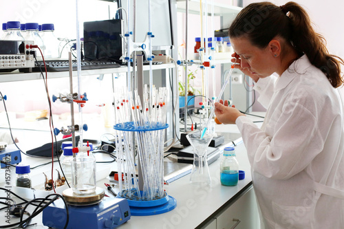 A student girl conducting experiments in chemical laboratory