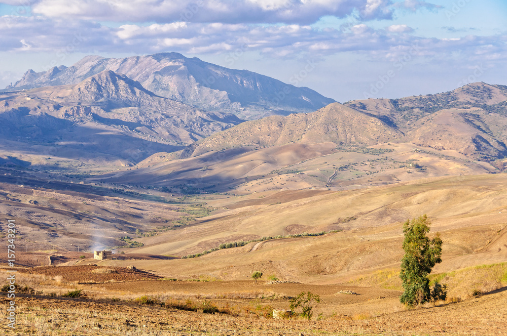 Obraz premium Ploughed fields and the Sicani Mountains between Agrigento and Palermo - Sicily, Italy