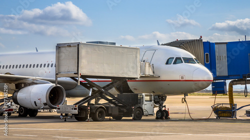 Passenger jet airplane docked on airport gate