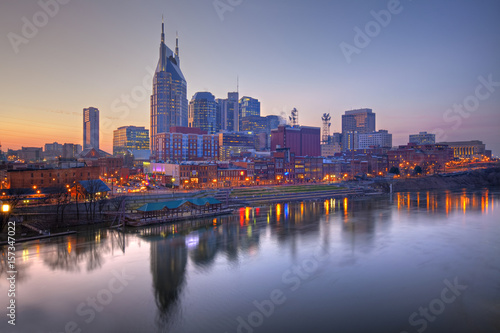 Skyline of Nashville  Tennessee at sunset showing reflections in the Cumberland River