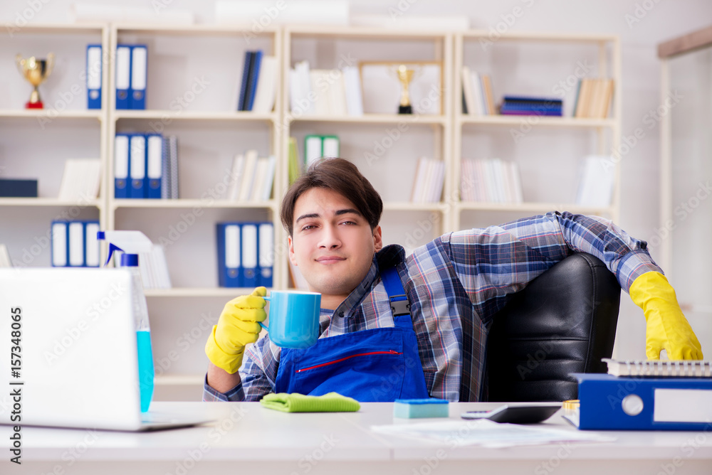 Male cleaner working in the office Male cleaner working in the office