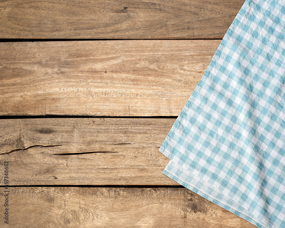Blue tablecloth on wooden table with copy space. Blue tablecloth on wooden table with copy space.
