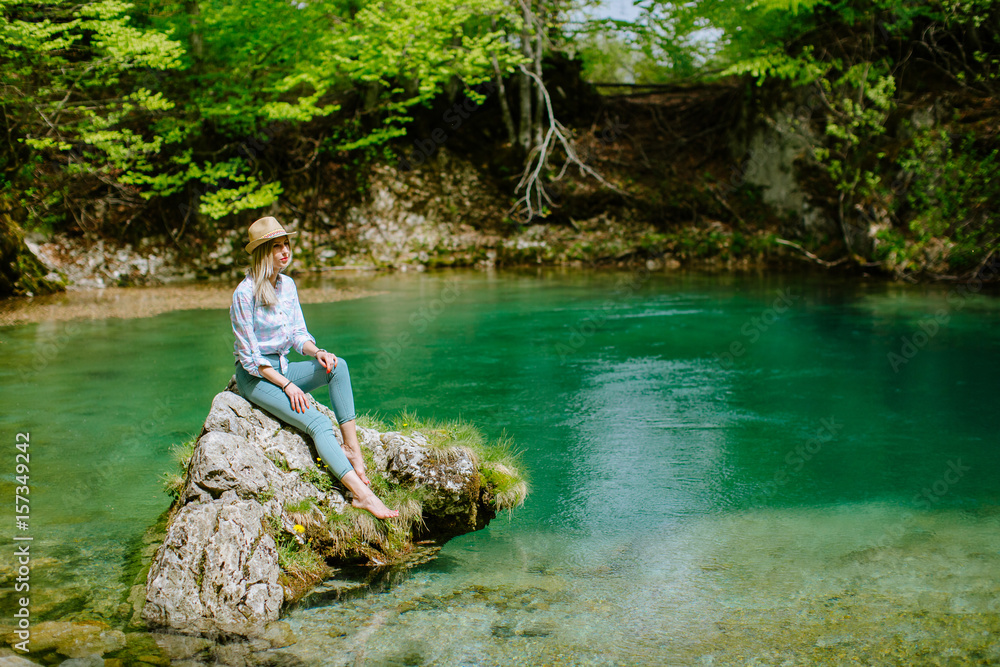 woman relax at mountain lake view woman relax at mountain lake view