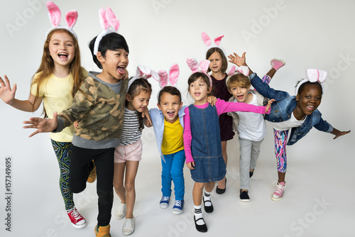 Group of Kids Wearing Bunny Ears for Easter Happiness Smiling on White Blackground