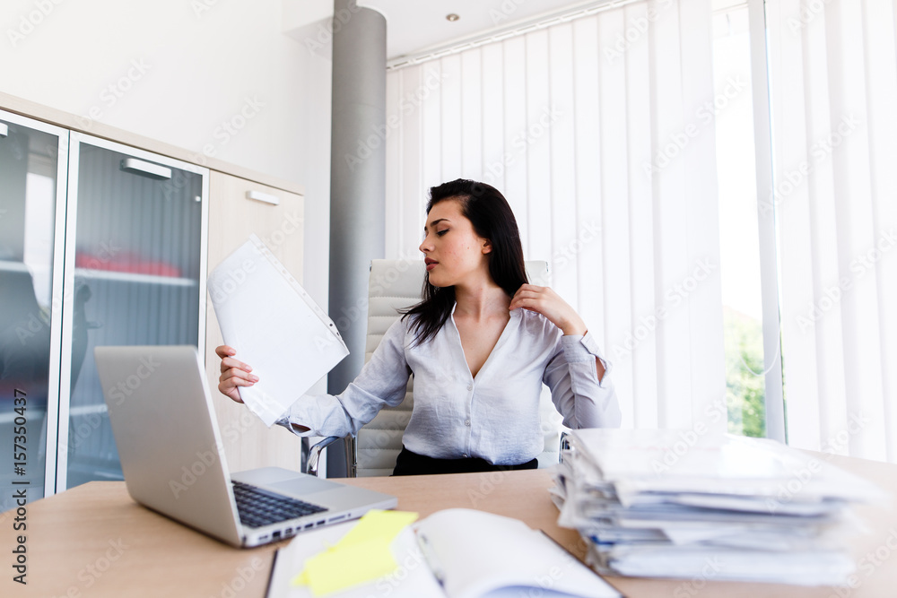 Depressed businesswoman in his office cant get the job done on time Depressed businesswoman in his office cant get the job done on time
