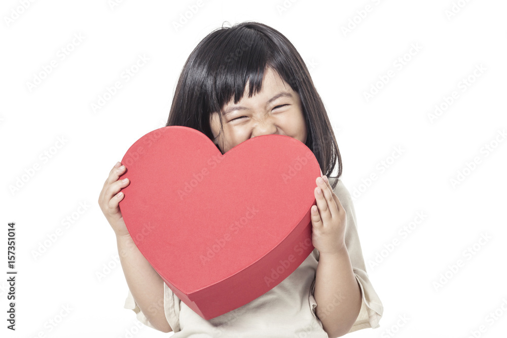 A little girl portrait with smile hold a red gift box isolated white. A little girl portrait with smile hold a red gift box isolated white.