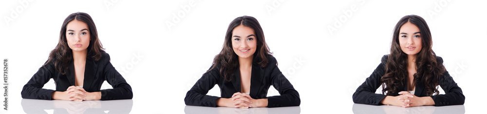 Young businesswoman sitting at desk on white Young businesswoman sitting at desk on white