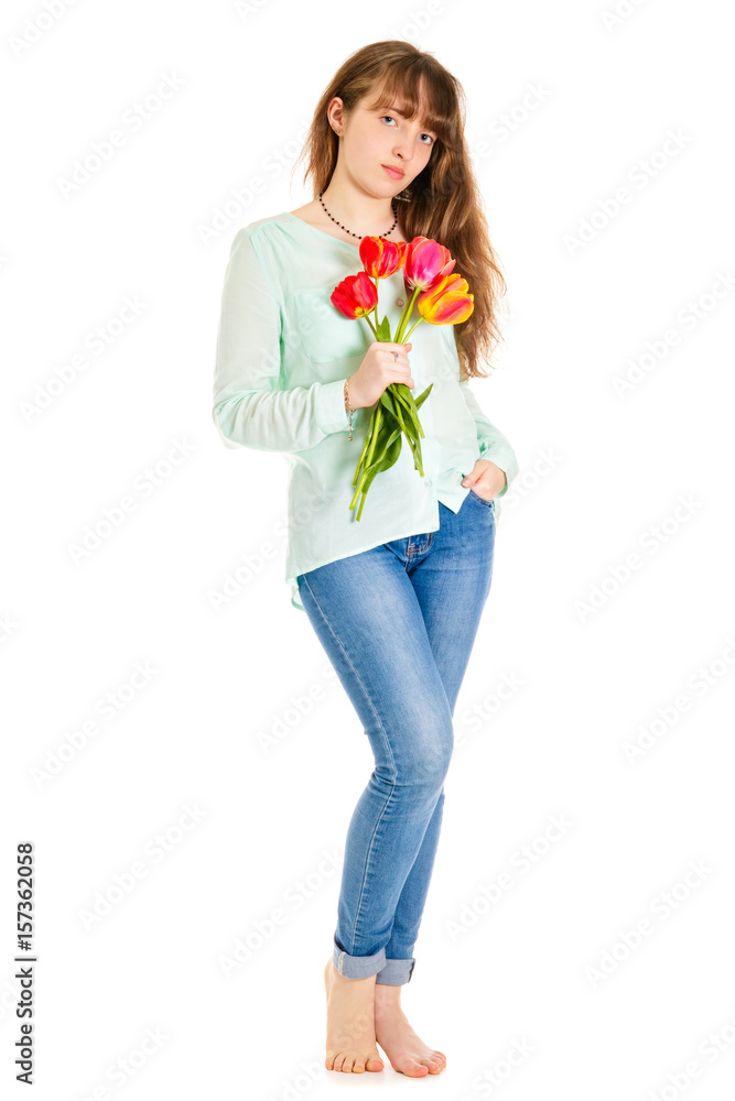 Attractive girl standing with tulips in hand. Isolated on a white background Attractive girl standing with tulips in hand. Isolated on a white background