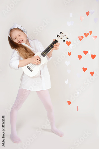 Funny girl playing hawaiian guitar