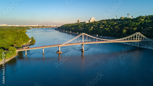 Aerial top view of pedestrian Park bridge and Dnieper river from above, city of Kiev, Ukraine 