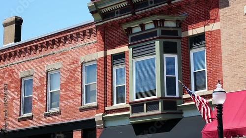 Establishing shot of generic window on sunny day in small American town photo