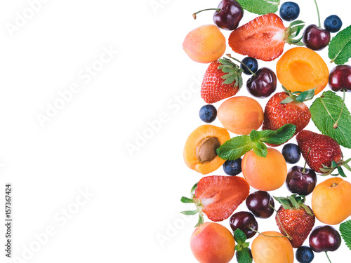 Apricot and berries isolated, top view, copy space